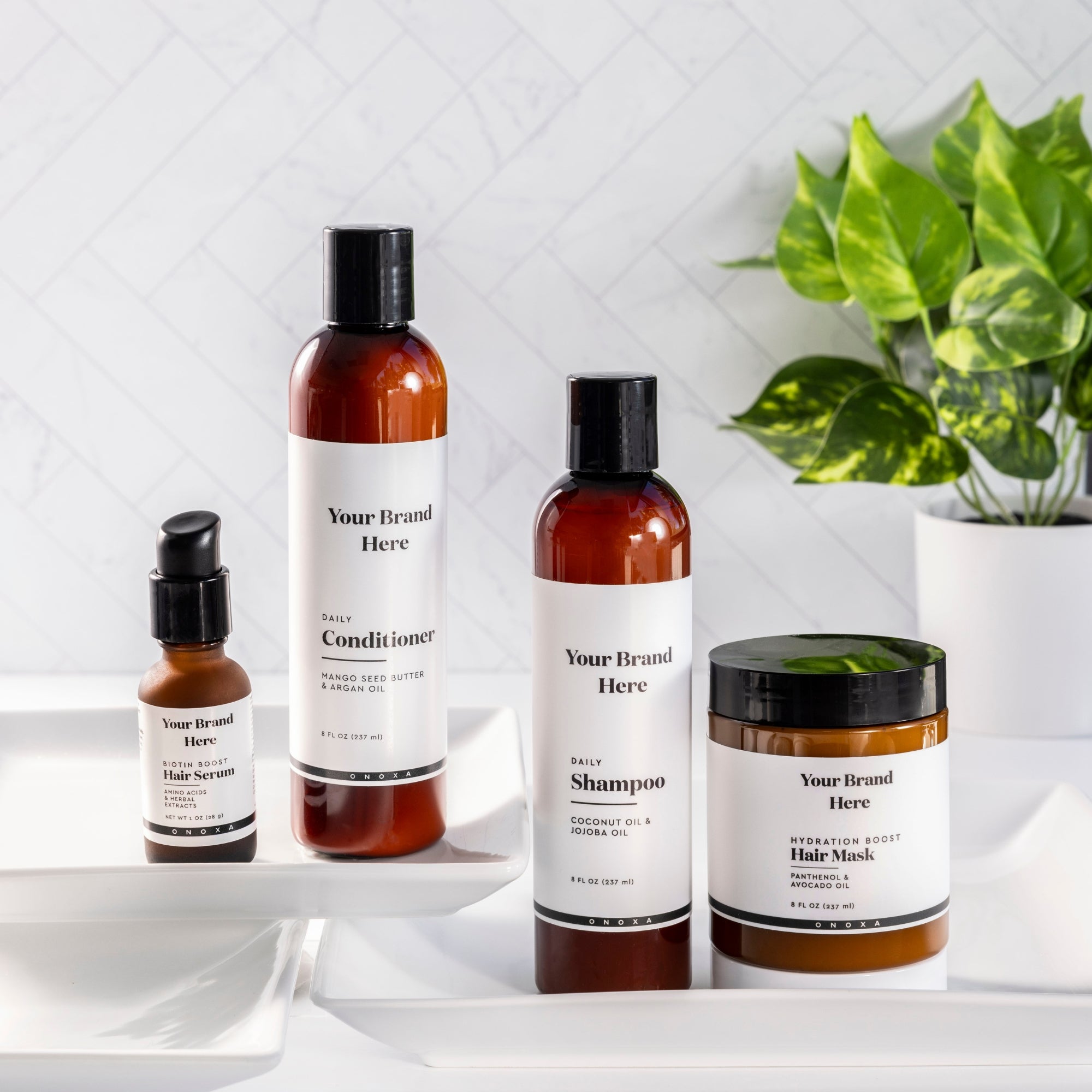 Onoxa's hair care products in amber bottles with black tops